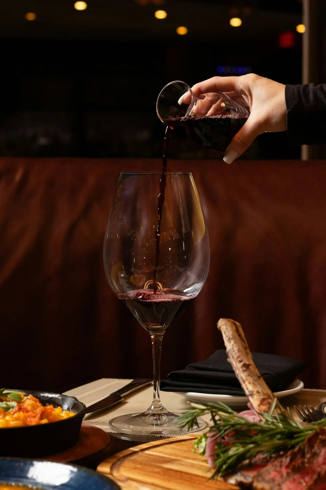Wine poured tableside at Meat Market